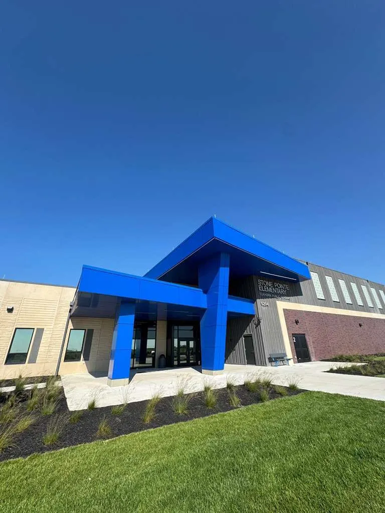 Stone Pointe Elementary — Blue ACM at both entrances — columns, fascias, soffits and transitions — plus Morin wall panel at the rooftop walls. (2/12)