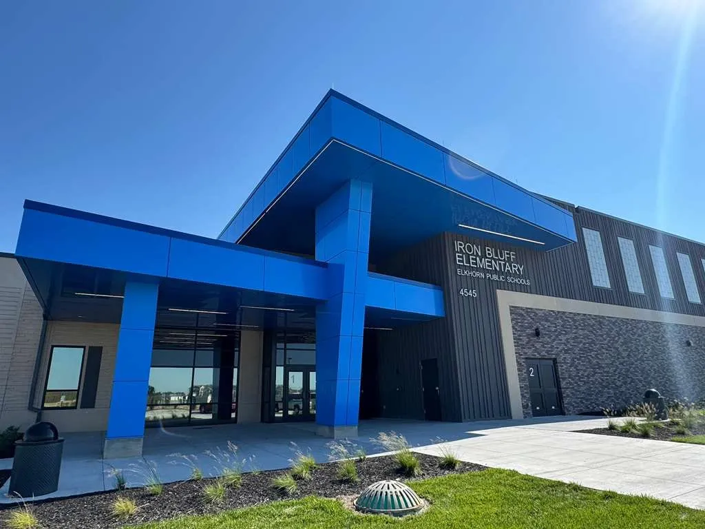 Iron Bluff Elementary — Blue ACM at both entrances — columns, fascias, soffits and transitions — plus Morin wall panel at the rooftop walls. (2/8)