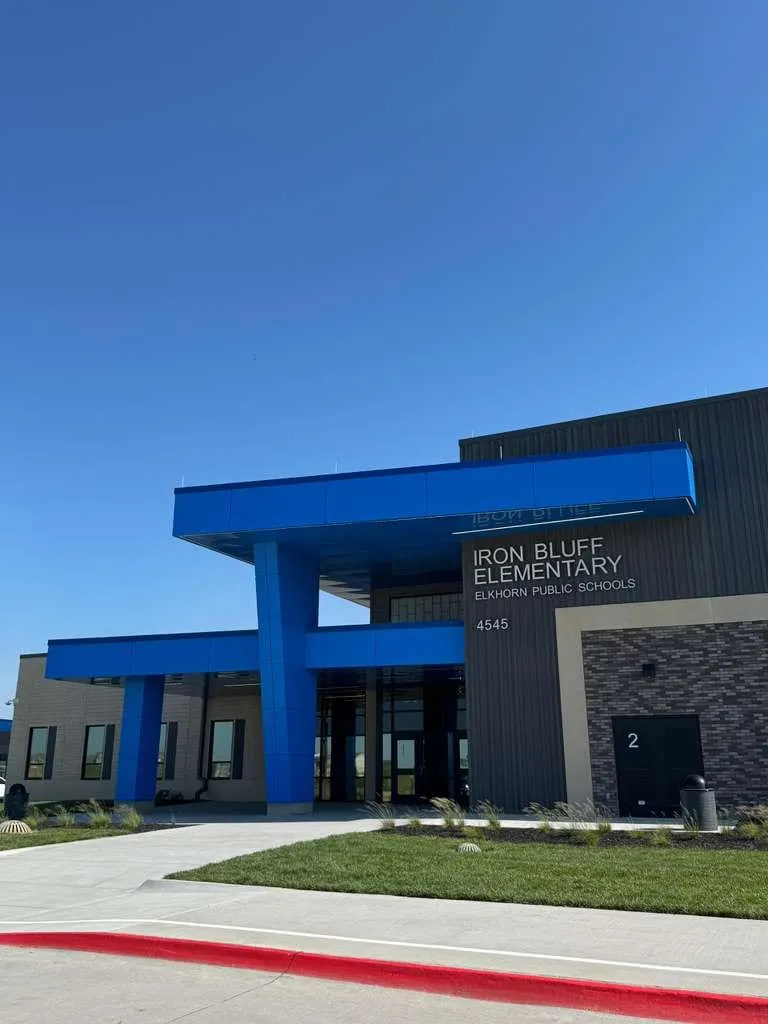 Iron Bluff Elementary — Blue ACM at both entrances — columns, fascias, soffits and transitions — plus Morin wall panel at the rooftop walls. (4/8)