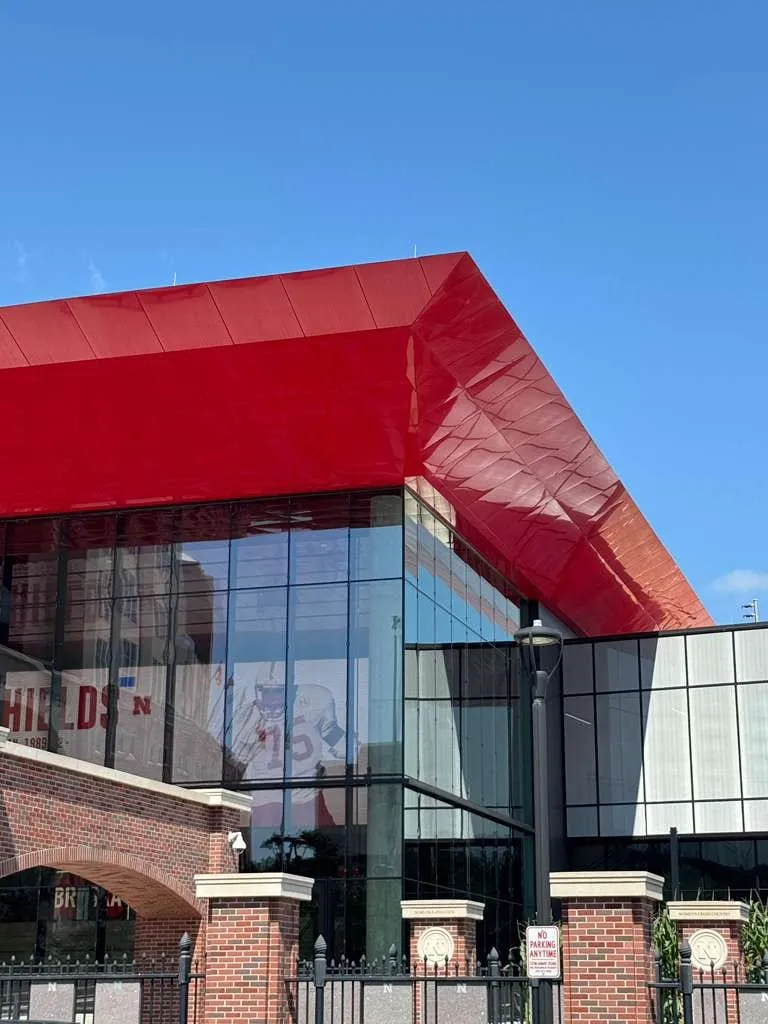 UNL Stadium Expansion — ACM installation across the canopy fascia, soffit and exterior elevations. (4/15)