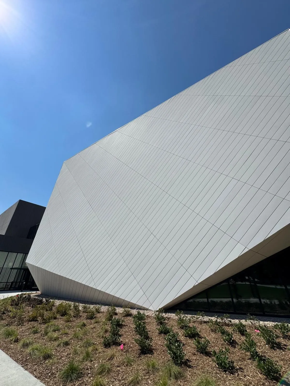 UNL Westbrook Music Building — Swisspearl fiber cement installation, SikaTack glue-on application. (5/16)