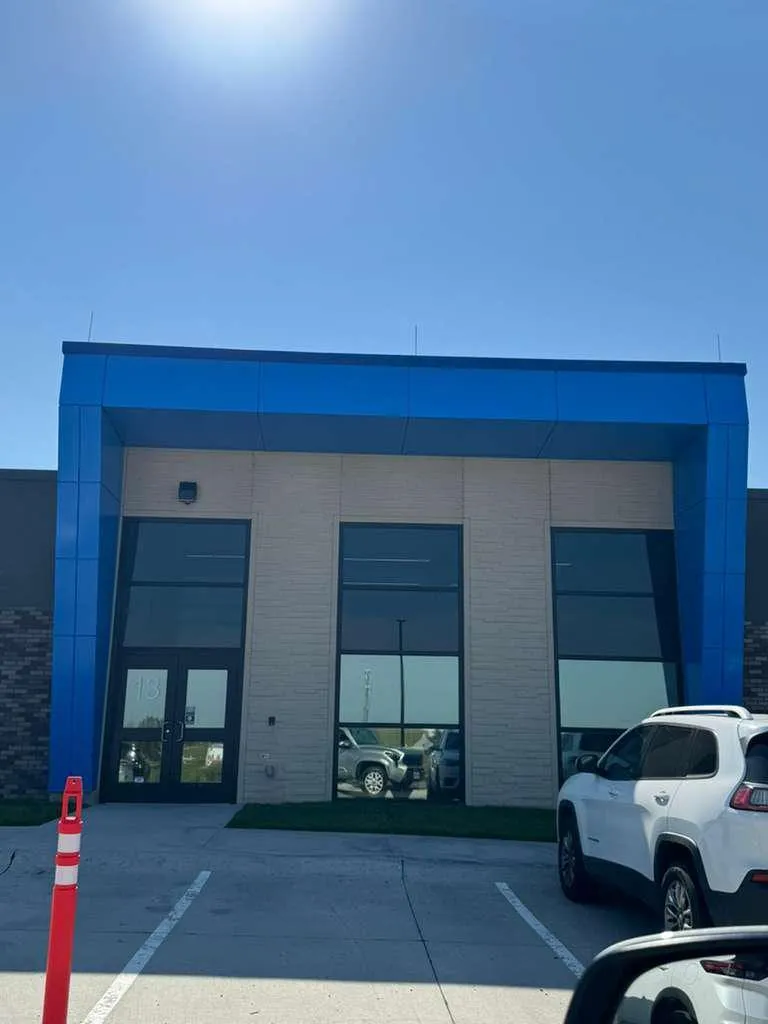 Iron Bluff Elementary — Blue ACM at both entrances — columns, fascias, soffits and transitions — plus Morin wall panel at the rooftop walls. (6/8)