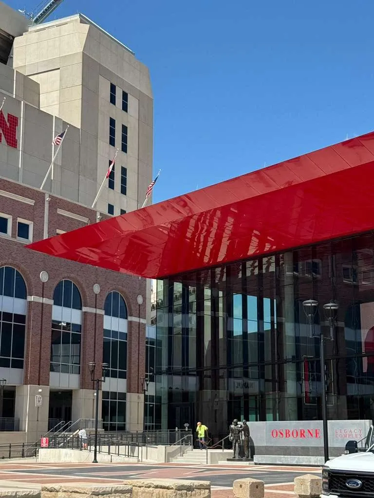 UNL Stadium Expansion — ACM installation across the canopy fascia, soffit and exterior elevations. (6/15)