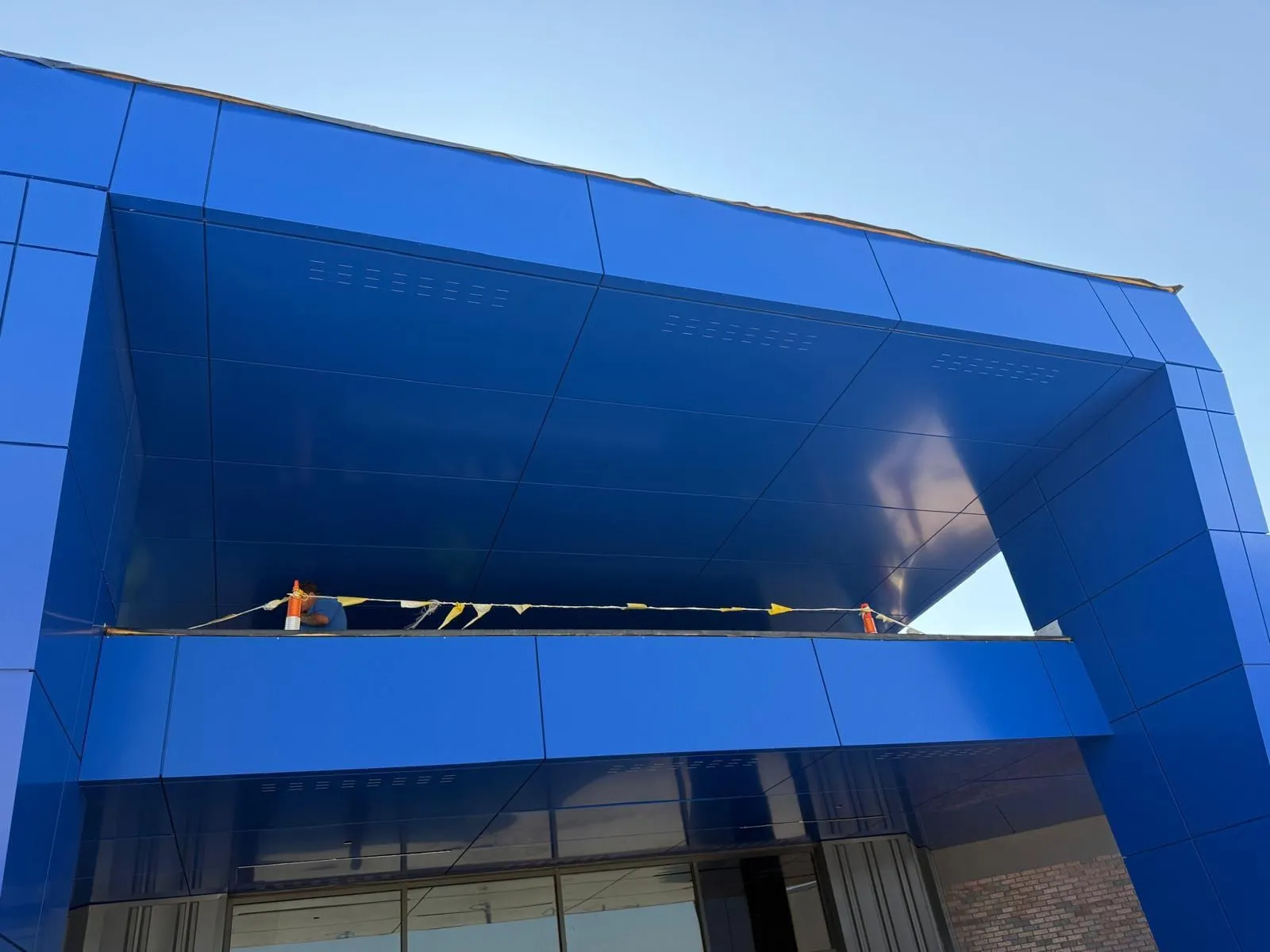Stone Pointe Elementary — Blue ACM at both entrances — columns, fascias, soffits and transitions — plus Morin wall panel at the rooftop walls. (7/12)