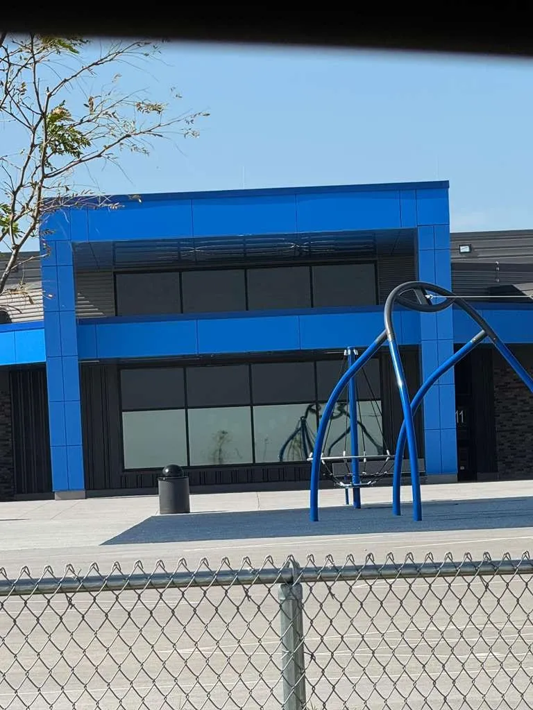 Iron Bluff Elementary — Blue ACM at both entrances — columns, fascias, soffits and transitions — plus Morin wall panel at the rooftop walls. (8/8)