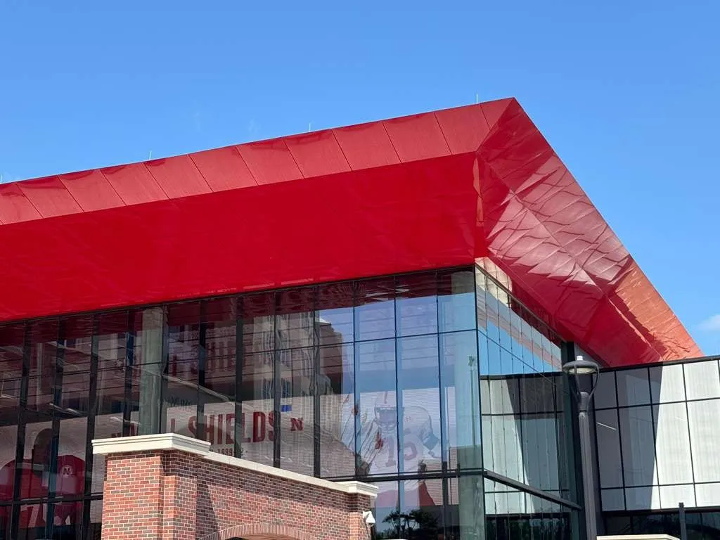 UNL Stadium Expansion — ACM installation across the canopy fascia, soffit and exterior elevations. (8/15)
