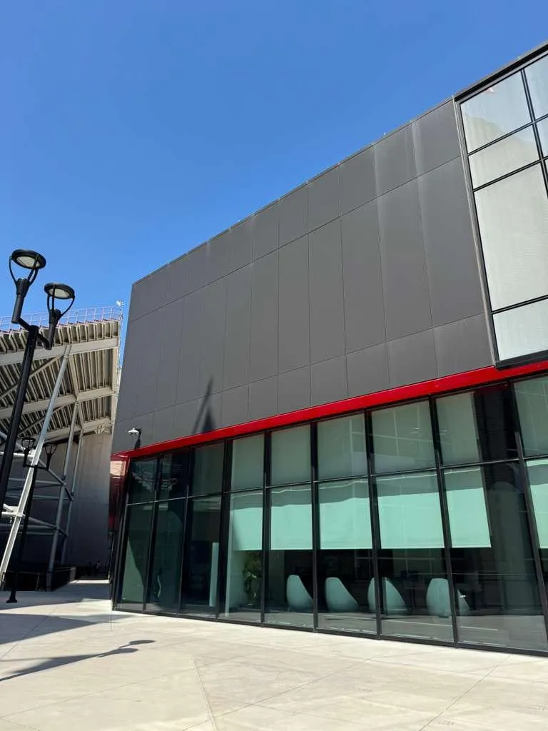 UNL Stadium Expansion — ACM installation across the canopy fascia, soffit and exterior elevations. (9/15)