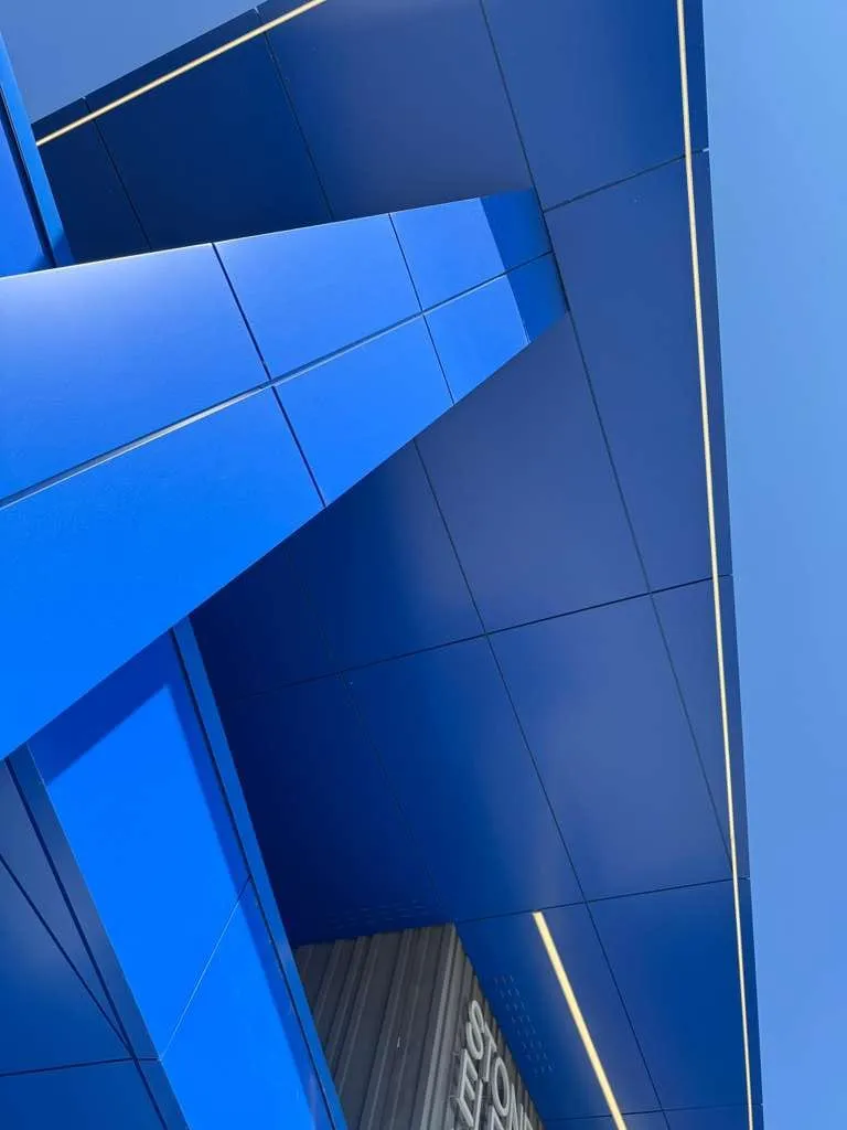 Stone Pointe Elementary — Blue ACM at both entrances — columns, fascias, soffits and transitions — plus Morin wall panel at the rooftop walls. (9/12)