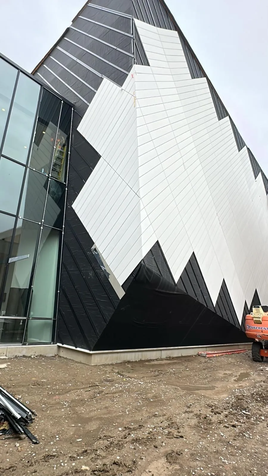 UNL Westbrook Music Building — Swisspearl fiber cement installation, SikaTack glue-on application. (13/16)