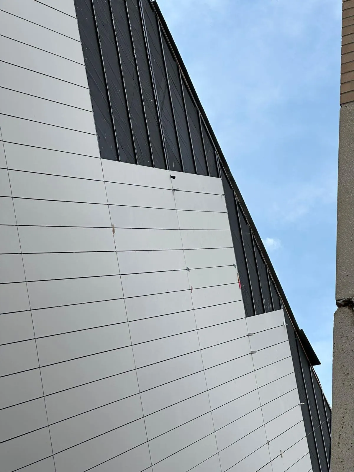 UNL Westbrook Music Building — Swisspearl fiber cement installation, SikaTack glue-on application. (14/16)