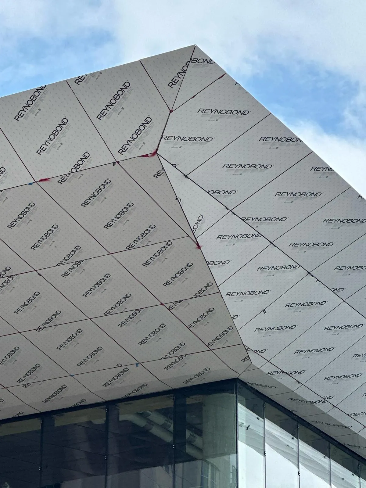 UNL Stadium Expansion — ACM installation across the canopy fascia, soffit and exterior elevations. (14/15)