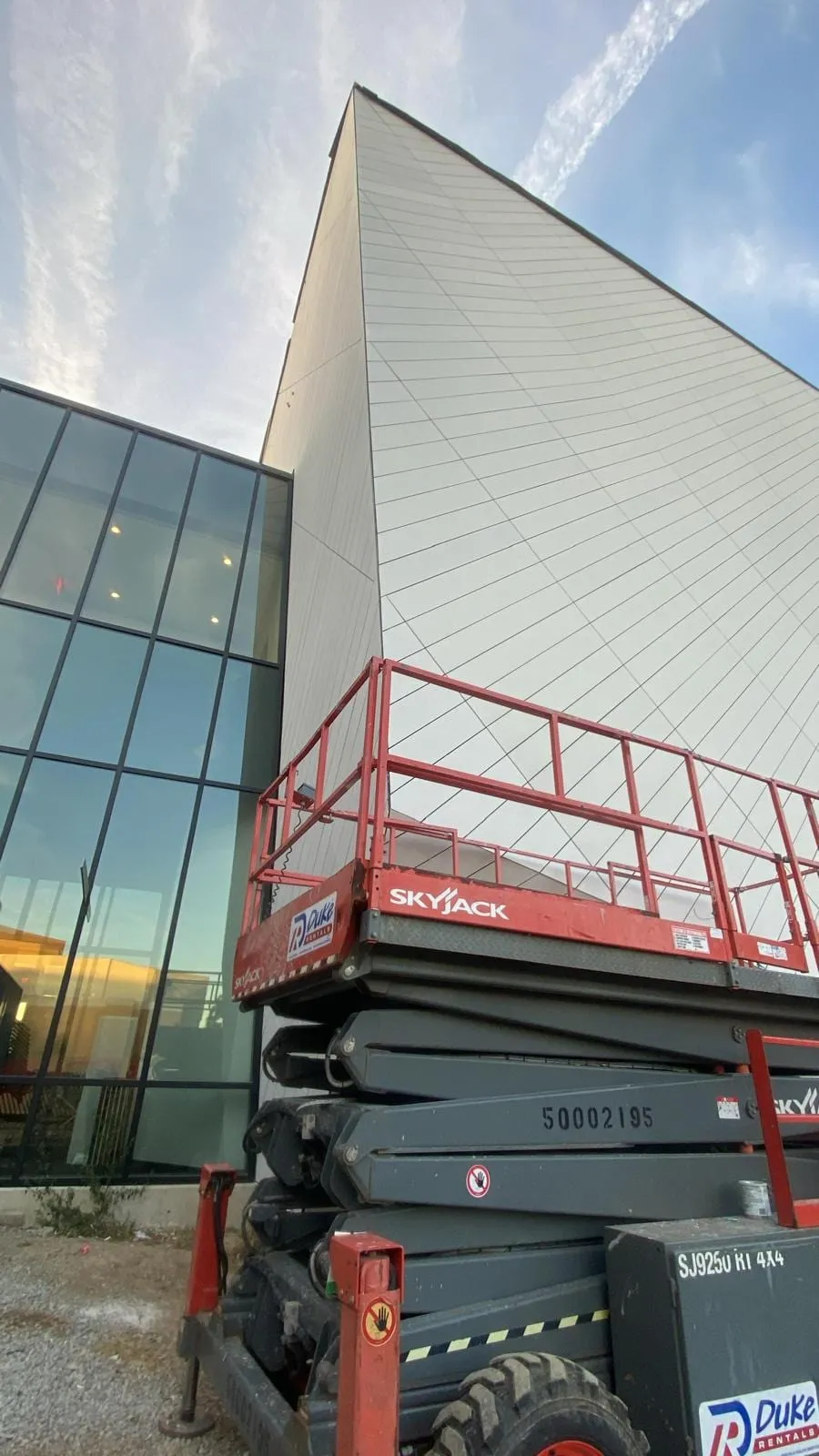 UNL Westbrook Music Building — Swisspearl fiber cement installation, SikaTack glue-on application. (15/16)